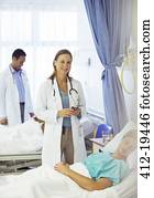 Doctor smiling in hospital room