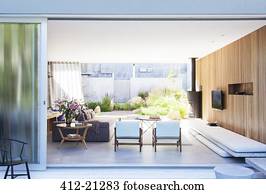 Sliding glass door opening to modern living room