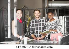 Portrait creative business people working in office