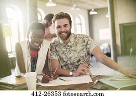 Portrait creative business people drawing diagram in office