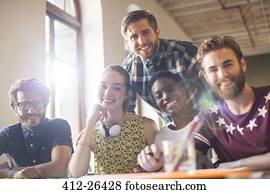 Portrait smiling creative business people in meeting