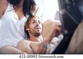 Casual couple using laptop