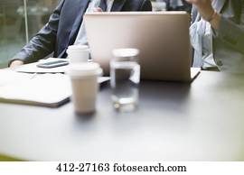 Business people working at laptop