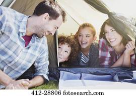 Smiling family in tent