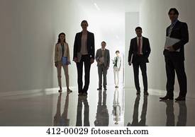 Portrait of business people in corridor