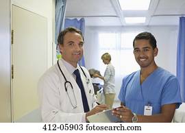 Doctor and nurse talking in hospital room Doctor and nurse talking in hospital room