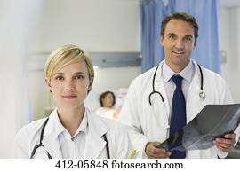 Doctors standing in hospital room