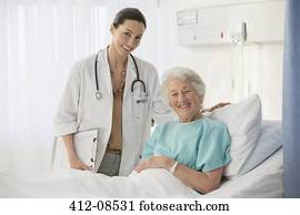 Portrait of doctor and aging patient in hospital room