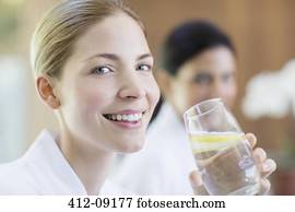 Woman drinking glass of water Woman drinking glass of water