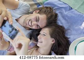 Couple taking self-portrait with camera phone