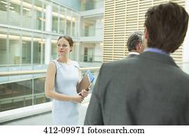 Business people standing in office