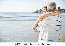 Senior couple hugging on beach