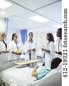 Doctor teaching residents in hospital room