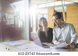 Business people working on laptop in office