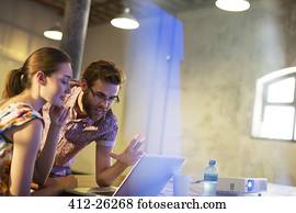 Business people working at laptop