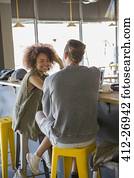 Friends talking at cafe bar