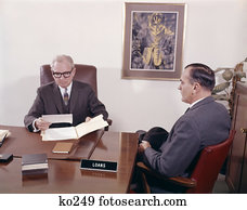 1960S Man Talking To Banker Loan Officer Loans Bank Desk