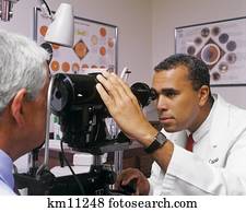 examining optometrist ophthalmologist