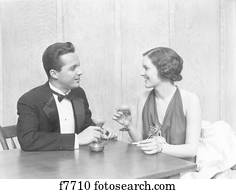 https://cdn-grid.fotosearch.com/CLT/CLT011/1930s-1940s-couple-drinking-toasting-stock-photography__f7710.jpg