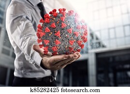 Businessman holds a bic bacteria of covid 19 ready to be examined in hospital Businessman holds a bic bacteria of covid 19 ready to be examined in hospital