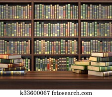Books on the table in the focus on the blurred background bookshelf full of books. Concept of library. Books on the table in the focus on the blurred background bookshelf full of books. Concept of library.