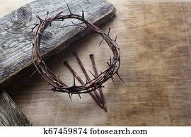 Jesus Crown Thorns and nails on Old and Grunge Wood Background. Vintage Retro Style.