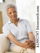 Woman sitting in living room