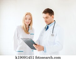 young male doctor and female nurse in hospital
