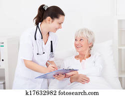 Doctor Giving Prescriptions To Patient