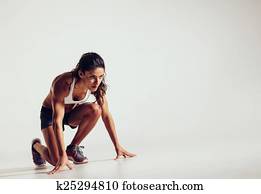 Focused woman ready for a run Focused woman ready for a run