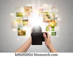 Hand captures life events with digital camera