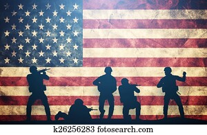 Soldiers in assault on USA flag. American army, military concept.