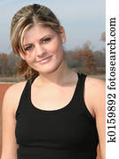 Athletic Young Woman Outside at Track