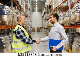 worker and businessmen with clipboard at warehouse worker and businessmen with clipboard at warehouse