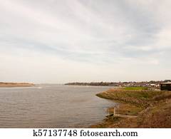 large bay of water coast line spring day overcast nature background