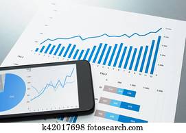 Reviewing financial report. Document and smart phone.