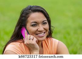 Asian Model On Telephone In Park