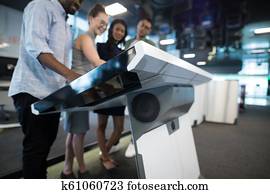 Business executives touching digital screen