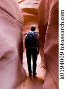 Hiker in slot canyon Hiker in slot canyon