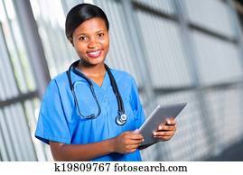 african doctor using tablet computer