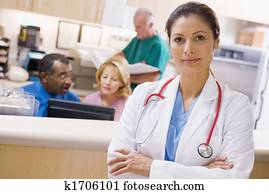 Doctors And Nurses At The Reception Area Of A Hospital