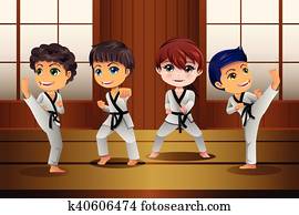 Kids Practicing Martial Arts in the Dojo Kids Practicing Martial Arts in the Dojo