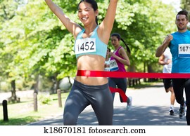 Marathon runner crossing finish line Marathon runner crossing finish line