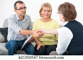 Couple talking with financial advisor