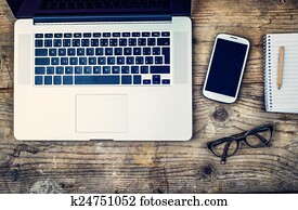 Desktop mix on a wooden office table.