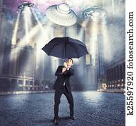 Businessman against alien attack