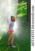 Girls and sprinkler