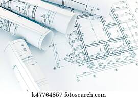 rolls of architecture blueprints with floor plan drawing on architects workspace rolls of architecture blueprints with floor plan drawing on architects workspace