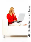 Women with laptop on couch