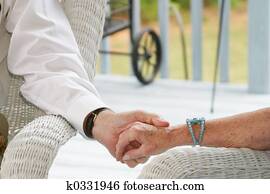 Seniors holding hand Seniors holding hand